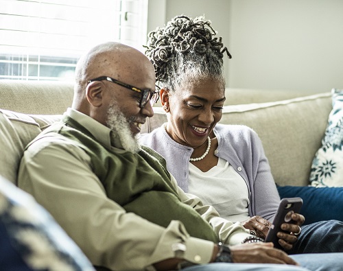 Senior couple donating