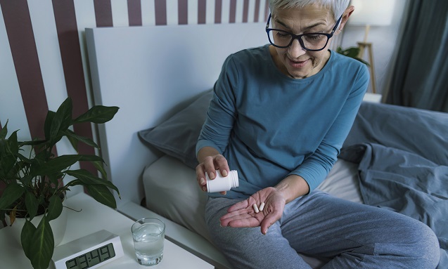 Senior checking her medication